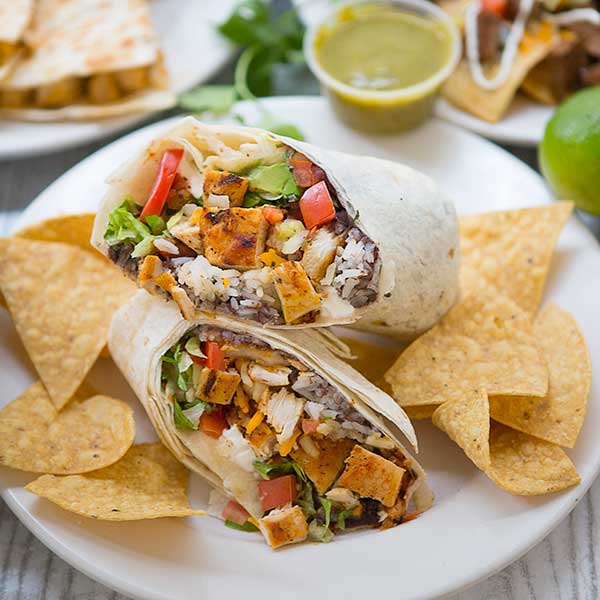 chicago food photographer Mexican chicken burrito wrap in white plate placed on the table